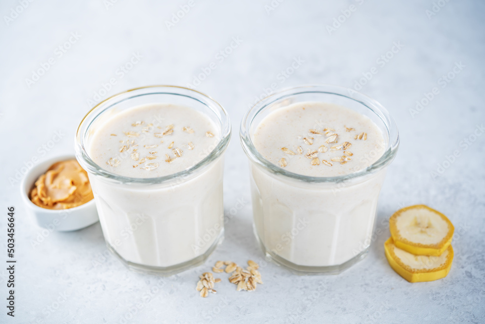 Peanut butter oats banana smoothie in a glass Peanut butter oats banana smoothie in a glass