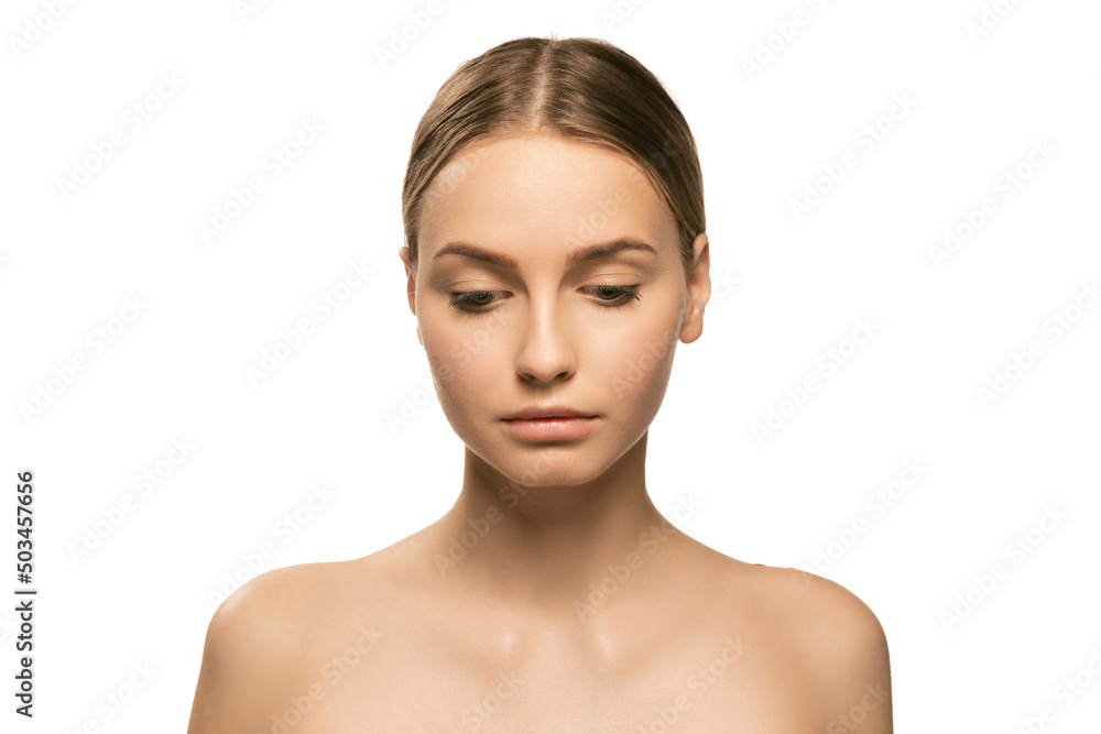 Portrait of young female fashion model without makeup isolated on white studio background. Spa, surgery, face lifting and skin care concept Portrait of young female fashion model without makeup isolated on white studio background. Spa, surgery, face lifting and skin care concept