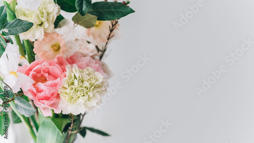 Obraz na plátně beautiful bouquet of carnations, daffodils, spray roses and white irises on a gr