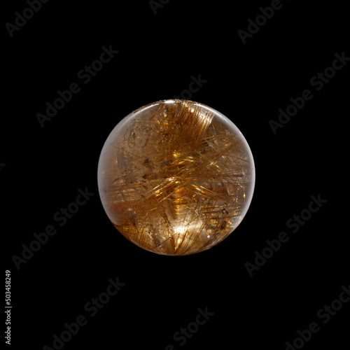 Ball of quartz with rutile on a black background
