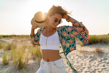 stylish attractive slim smiling woman on beach in summer style fashion trend outfit