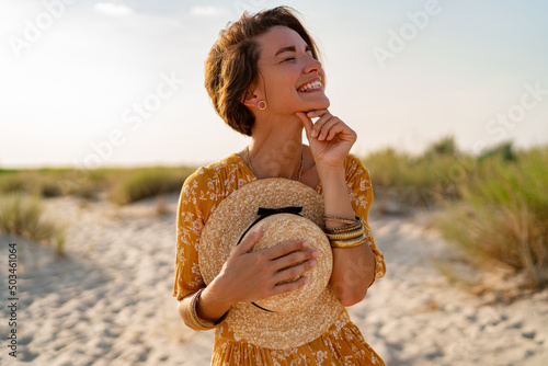 stylish attractive slim smiling woman on beach in summer style fashion trend outfit