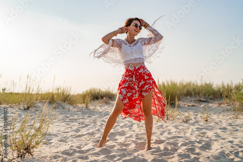 Canvas Print stylish attractive slim smiling woman on beach in summer style fashion trend out