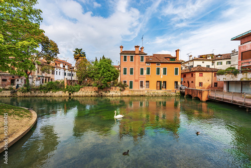 Fotografie Cityscape of Treviso downtown with the river Sile and the street called Via Pescheria (fish market street and island)