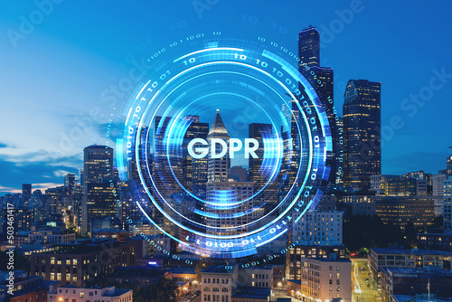 Illuminated aerial cityscape of Seattle, downtown at night time, Washington, USA. GDPR hologram, concept of data protection regulation and privacy for all individuals