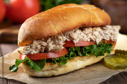 Tuna salad lettuce and tomato submarine sandwich