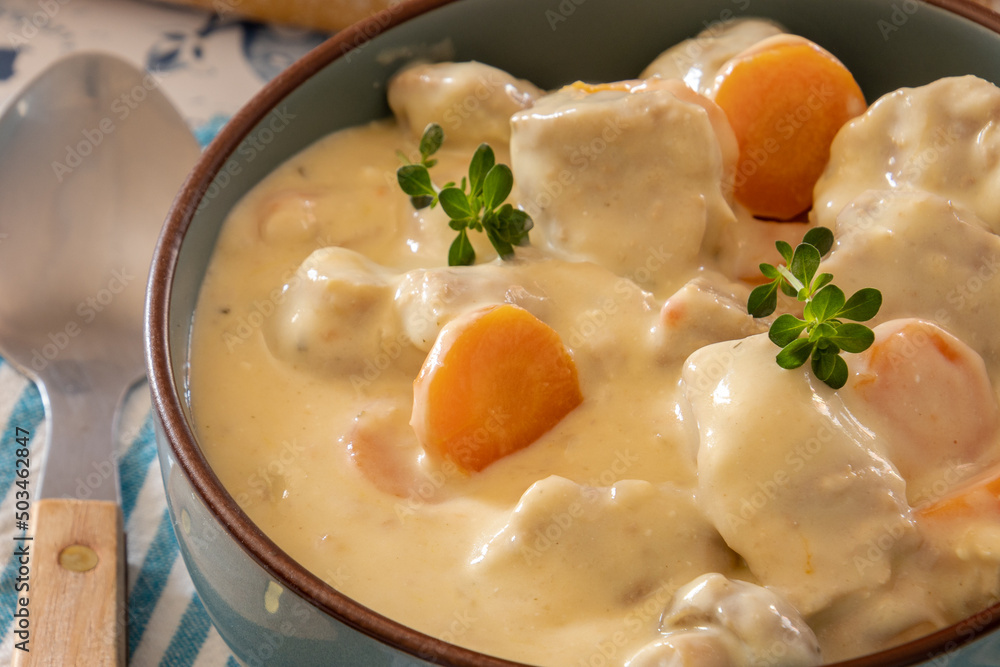 veal meat cooked with mushrooms and carrots in a dish veal meat cooked with mushrooms and carrots in a dish