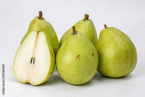 Fresh European pear - Pyrus communis, the common pear, is a species of pear native to central and eastern Europe, and western Asia, isolated in white background, shot under studio setup.