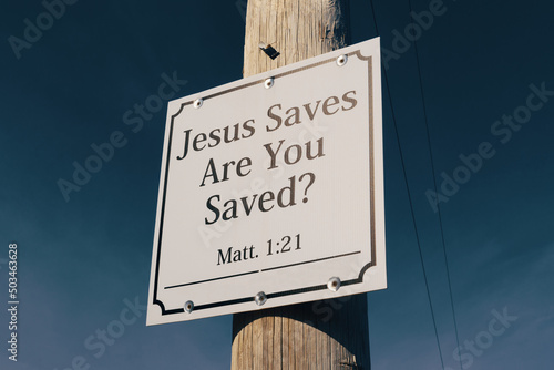 Jesus saves sign on telephone pole promising salvation photo