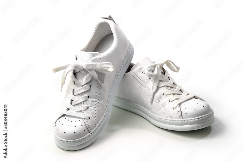 Pair of Stylis New White Sneakers Over White Background. Horizontal Image