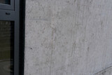 concrete gray wall of an architectural building, building material, texture for a designer