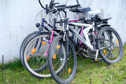 group of parked bicycles, with closed fixing locks, the concept of a modern ecological vehicle, active lifestyle, bicycle theft