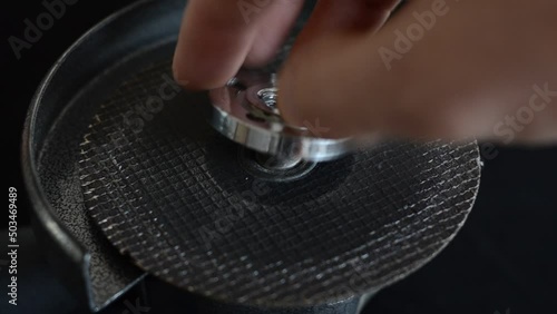 The master installs the cutting wheel in the angle grinder	

