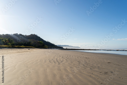 Beautiful empty beach in the morning light Playa Hermosa in Santa Tersa, Costa Rica.