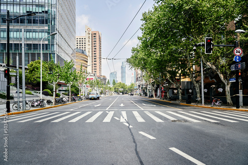 SHANGHAI, CHINA - APRIL 21, 2022: Empty and quiet street around Middle Huaihai Road in lockdown photo