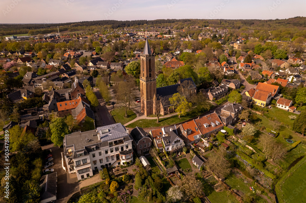 Dutch painterly picturesque village of Amerongen showing the church tower in the town center rising above the green hub. Aerial Dutch nobility landscape