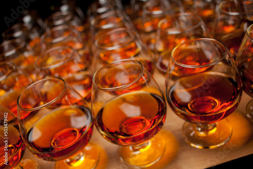 Fotótapéta glasses with cognac, whiskey stand on the bar