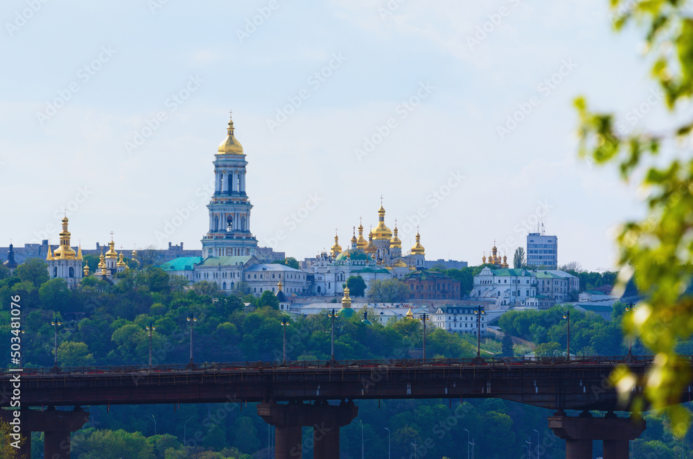 Picturesque spring landscape view of famous Kyiv's hills against sky. Scenic landscape of ancient Kyiv Pechersk Lavra. It is a historic Orthodox Christian monastery. Kyiv, Ukraine