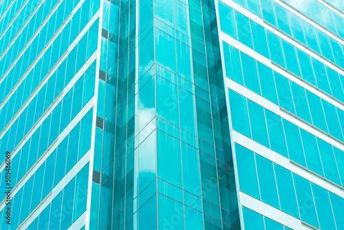 underside panoramic and perspective view to steel blue glass high rise building skyscrapers