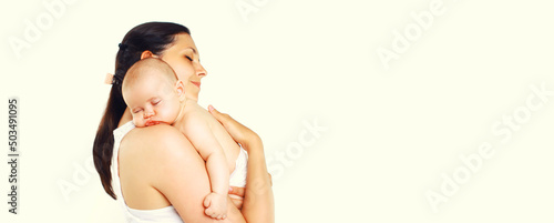 Baby sleeping on mother's hands on white background, blank copy space for advertising text © rohappy