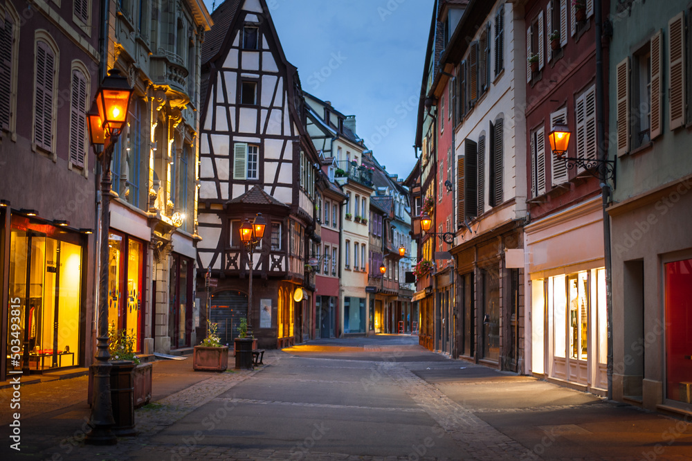 historical wooden half-timbered architecture of the alsace town in a dusk