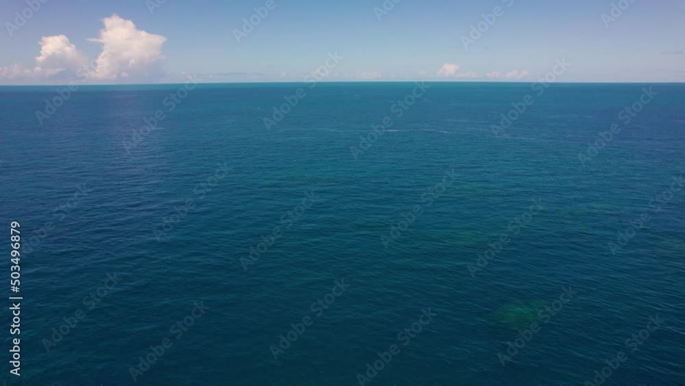 Blue Ocean and the horizon. Flying over a coral reef in Brazil Blue Ocean and the horizon. Flying over a coral reef in Brazil