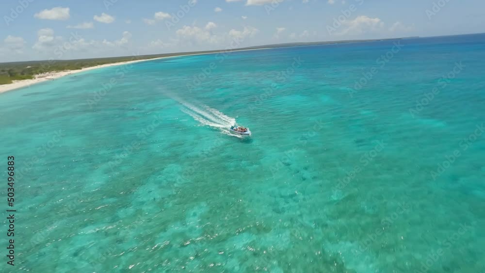 FPV drone over boat in turquoise waters of Caribbean; Bahia de Las Aguilas FPV drone over boat in turquoise waters of Caribbean; Bahia de Las Aguilas