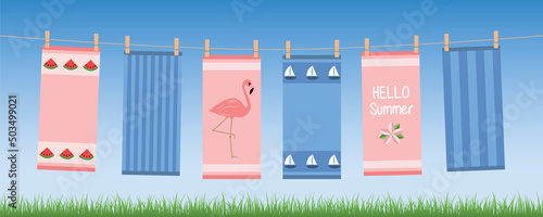 happy summer holiday banner with colorful hanging towels
