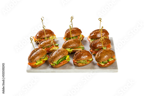 mini sandwiches of whole grain bread with salmon cucumber and lettuce leaves