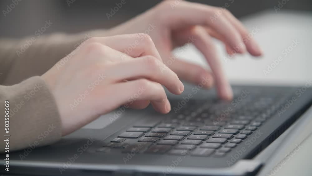 Hands on laptop. Person typing text on a keyboard Hands on laptop. Person typing text on a keyboard