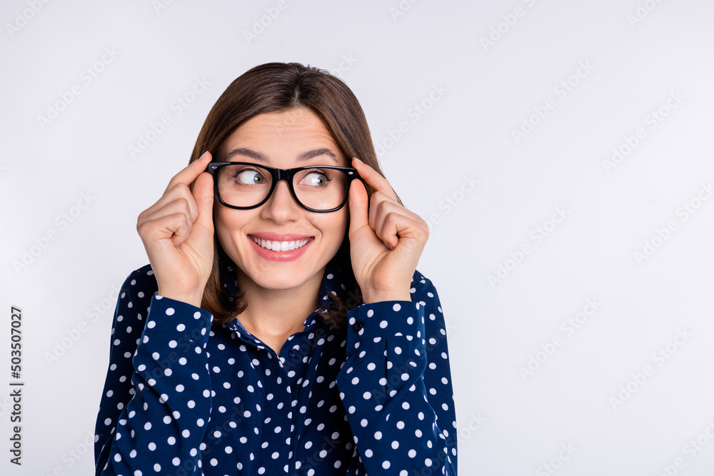 Portrait of attractive funny curious cheerful girl looking aside copy space guess isolated over grey pastel color background Portrait of attractive funny curious cheerful girl looking aside copy space guess isolated over grey pastel color background