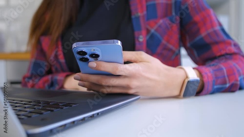 Person using phone. Female browsing mobile app on a modern smartphone with triple camera in close up video clip