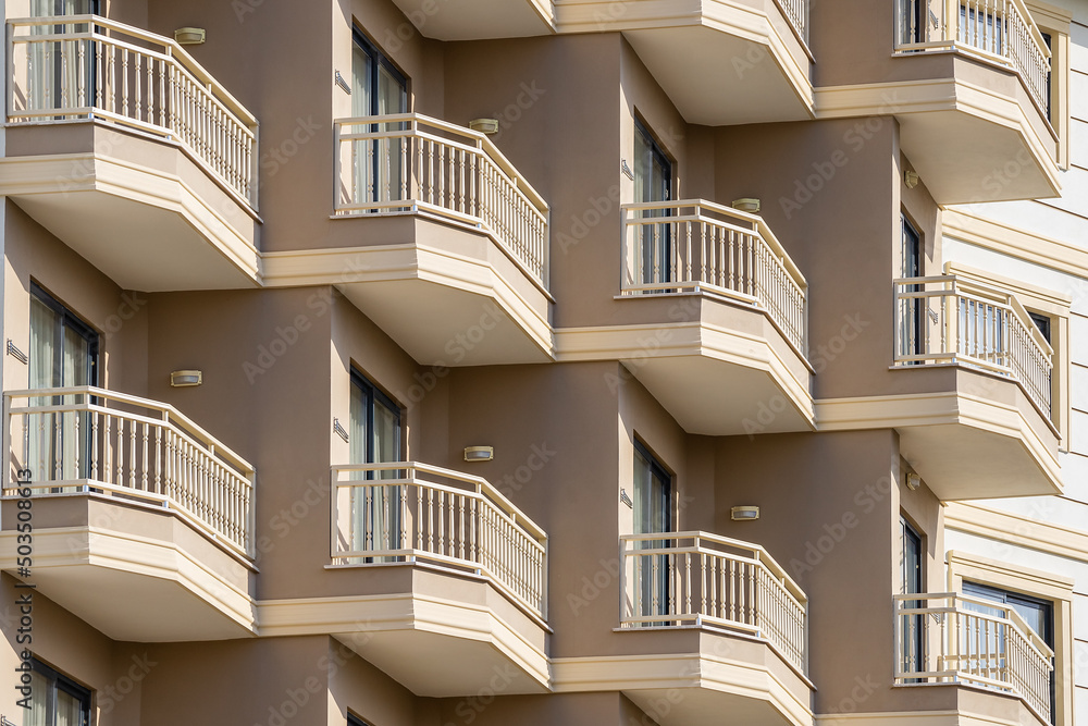 Fototapeta premium A row of identical balconies in a tall building.