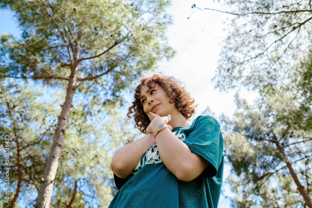 Young redhead woman wearing green tee touching mouth with her hands with painful expression because of toothache or dental illness on teeth. Health concepts. Young redhead woman wearing green tee touching mouth with her hands with painful expression because of toothache or dental illness on teeth. Health concepts.