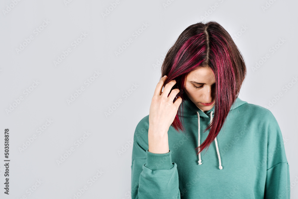 Mental health, depression, Anger, Anxiety, Bipolar disorder and panic attacks concept. Studio portrait of unhappy young woman Mental health, depression, Anger, Anxiety, Bipolar disorder and panic attacks concept. Studio portrait of unhappy young woman