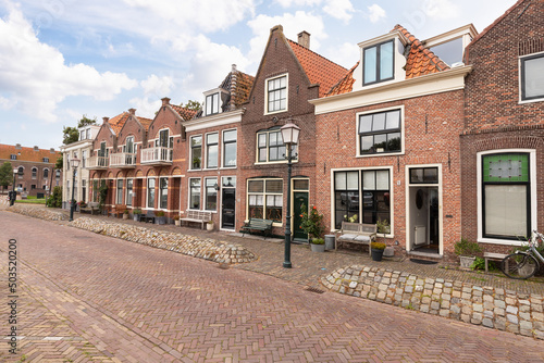 Old historic houses along the quay of the harbor in the city of Hoorn in the Netherlands. photo