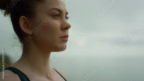 Girl breathing deeply enjoying harmony on nature close up. Woman meditating yoga
