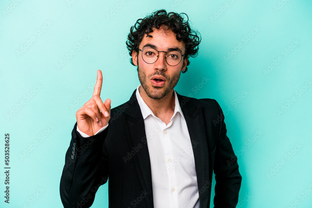 Young caucasian business man isolated on blue background having an idea, inspiration concept. Young caucasian business man isolated on blue background having an idea, inspiration concept.