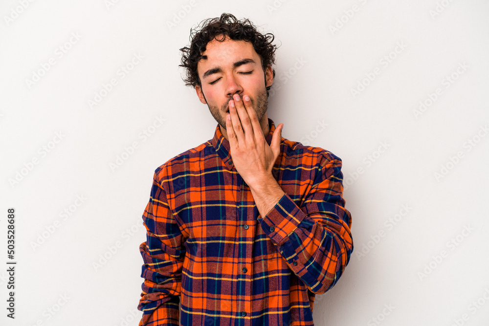 Young caucasian man isolated on white background yawning showing a tired gesture covering mouth with hand. Young caucasian man isolated on white background yawning showing a tired gesture covering mouth with hand.