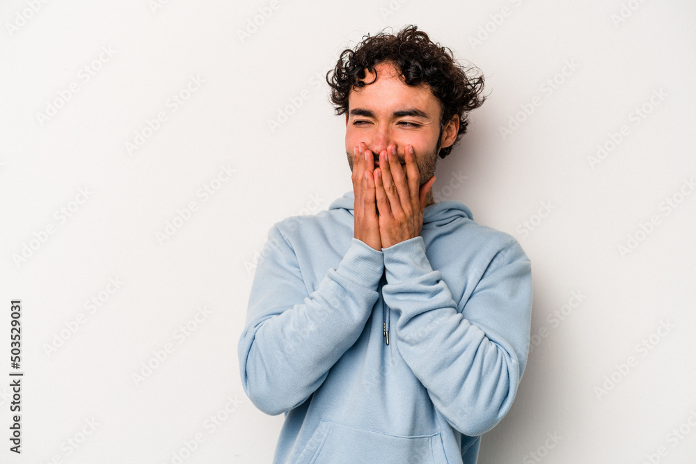 Young caucasian man isolated on white background laughing about something, covering mouth with hands. Young caucasian man isolated on white background laughing about something, covering mouth with hands.