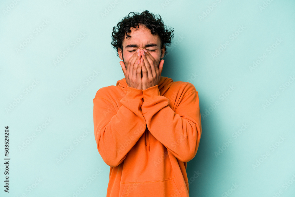 Young caucasian man isolated on white background laughing about something, covering mouth with hands. Young caucasian man isolated on white background laughing about something, covering mouth with hands.