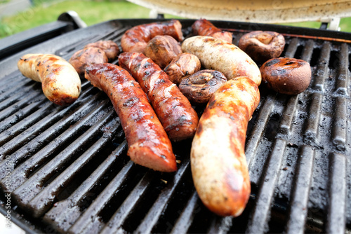 barbecue with poilsh sausages and mushrooms