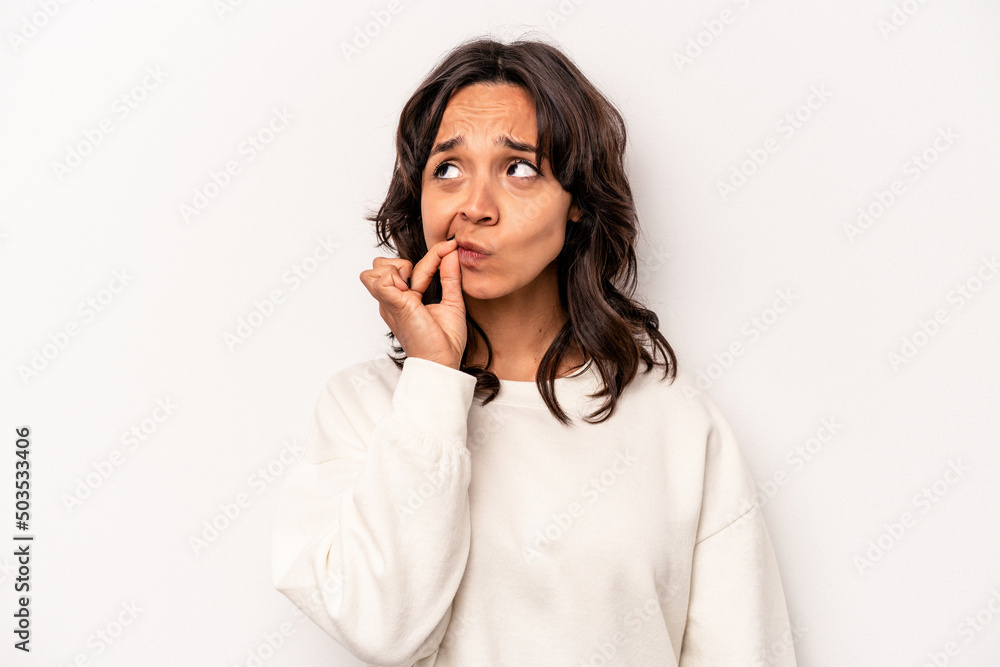 Young hispanic woman isolated on white background with fingers on lips keeping a secret. Young hispanic woman isolated on white background with fingers on lips keeping a secret.