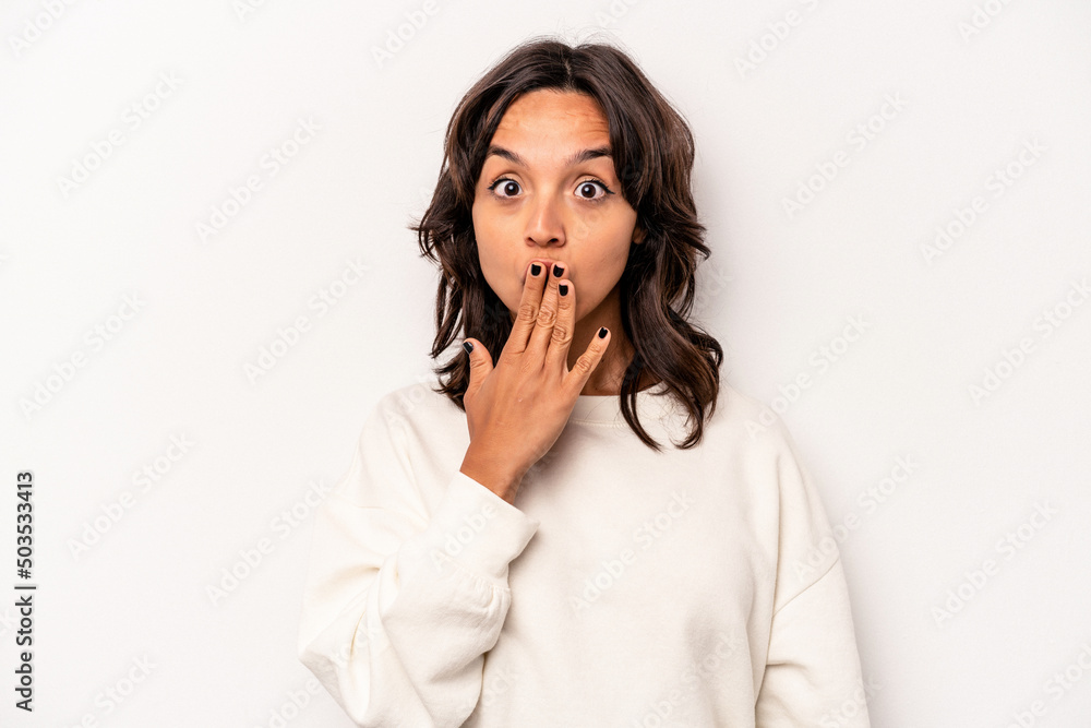 Young hispanic woman isolated on white background shocked, covering mouth with hands, anxious to discover something new. Young hispanic woman isolated on white background shocked, covering mouth with hands, anxious to discover something new.