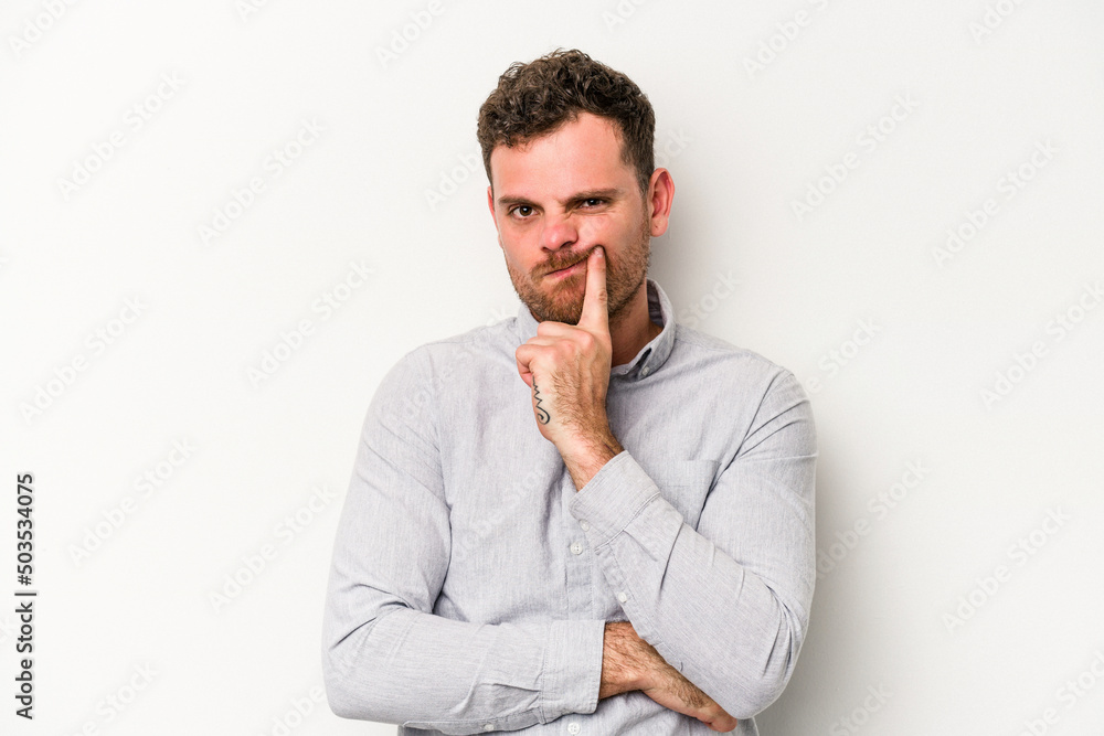 Young caucasian man isolated on white background unhappy looking in camera with sarcastic expression. Young caucasian man isolated on white background unhappy looking in camera with sarcastic expression.