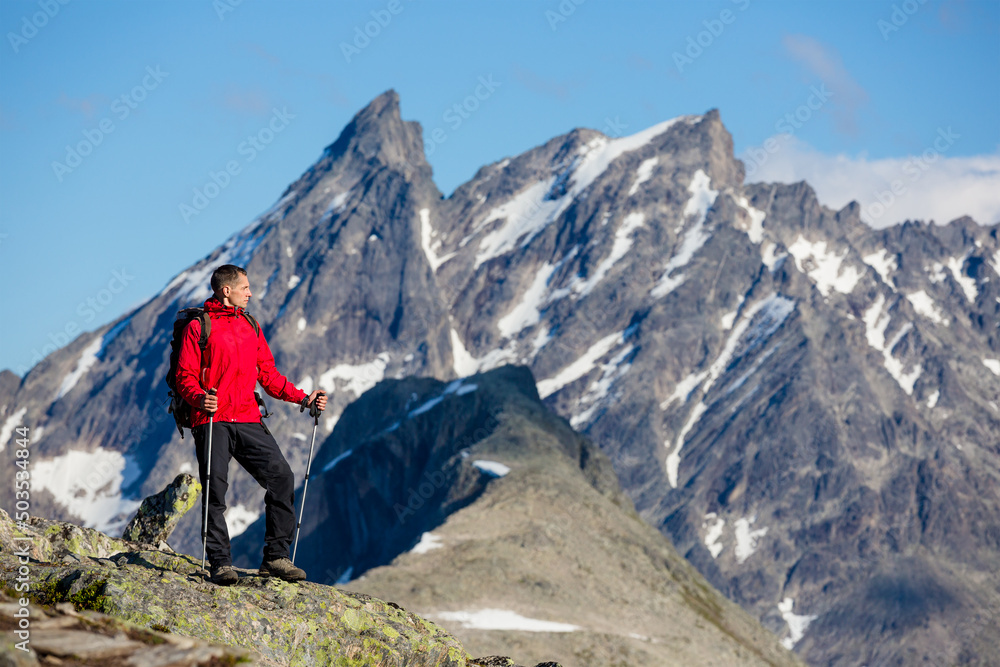 Fototapeta premium caucasian man hiking in mountains