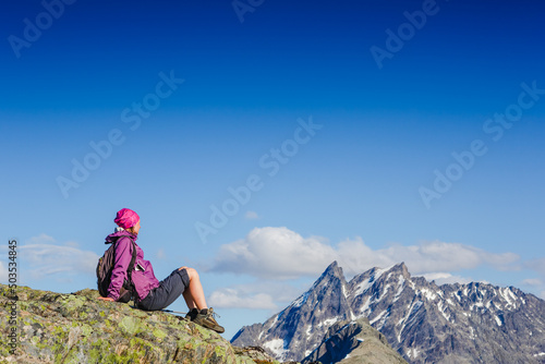 woman hiker enjoy the view on the cliff