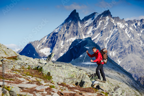 caucasian man hiking in mountains