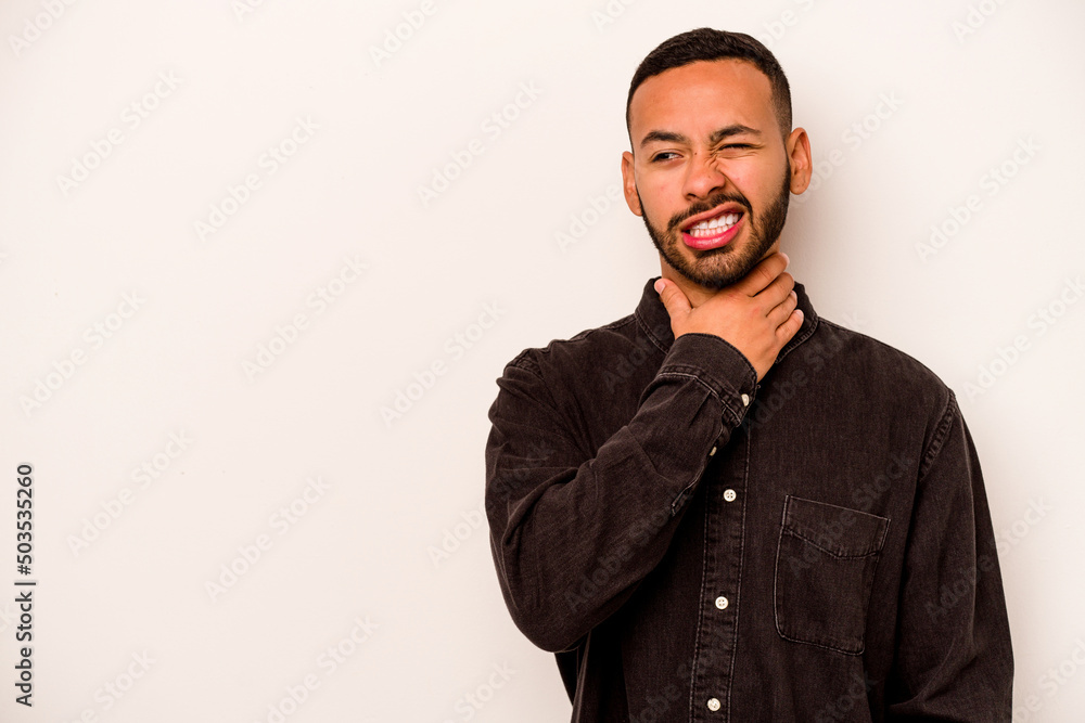Young hispanic man isolated on white background touching back of head, thinking and making a choice. Young hispanic man isolated on white background touching back of head, thinking and making a choice.