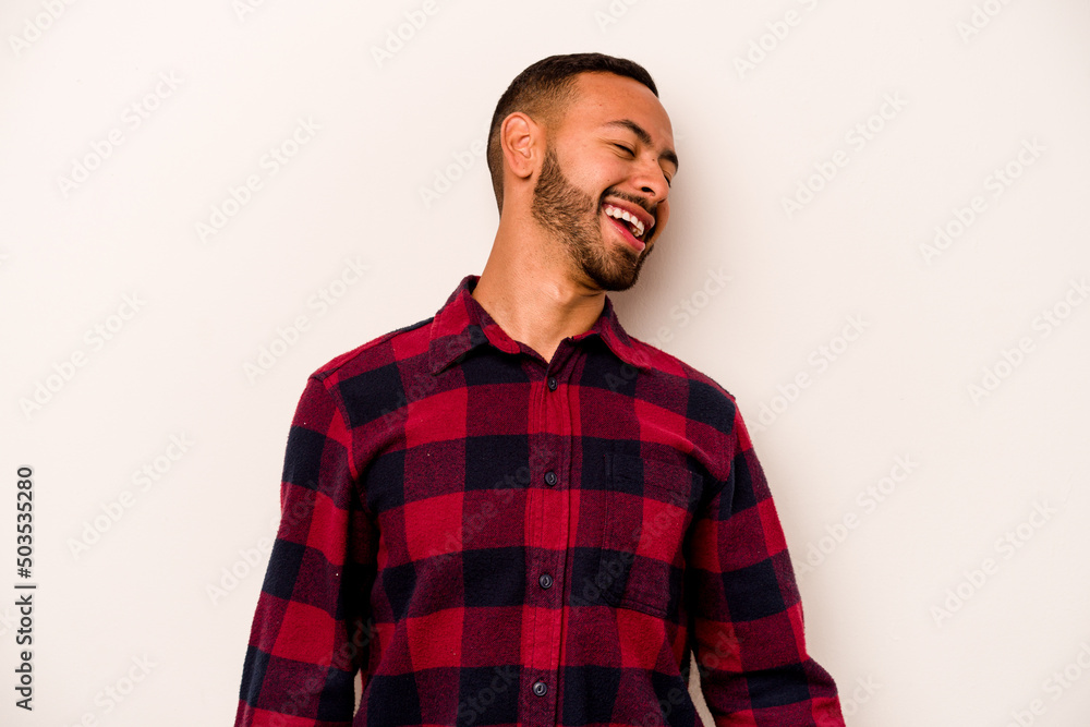 Young hispanic man isolated on white background dancing and having fun. Young hispanic man isolated on white background dancing and having fun.